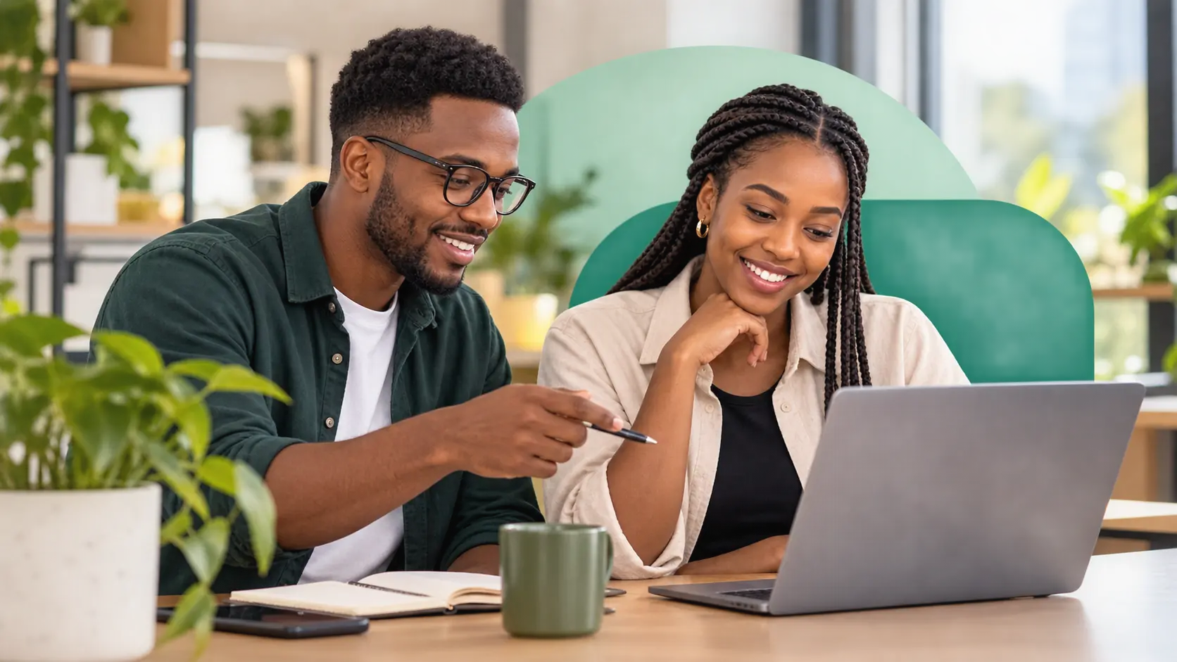 Editorial image of two professionals collaborating at a laptop.